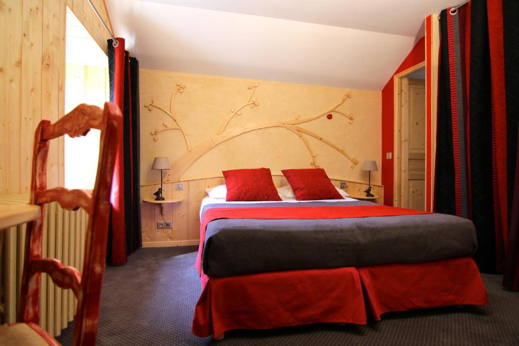 Postel nebo postele na pokoji v ubytování Auberge Le Cabaliros