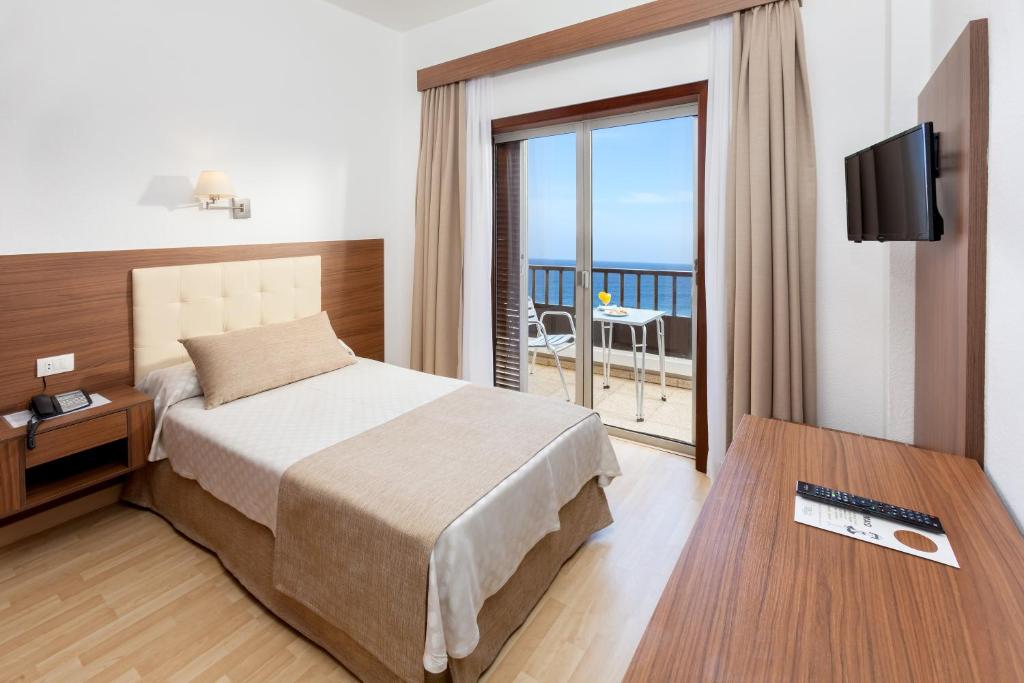 Postel nebo postele na pokoji v ubytování Hotel Don Manolito