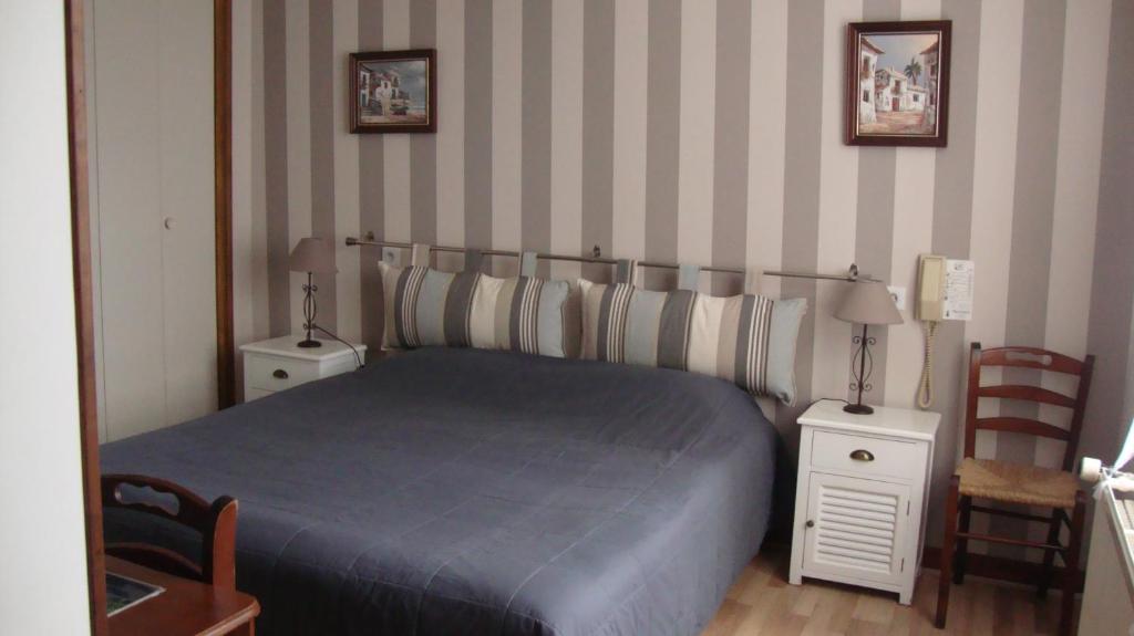 Postel nebo postele na pokoji v ubytování Hotel Pikassaria