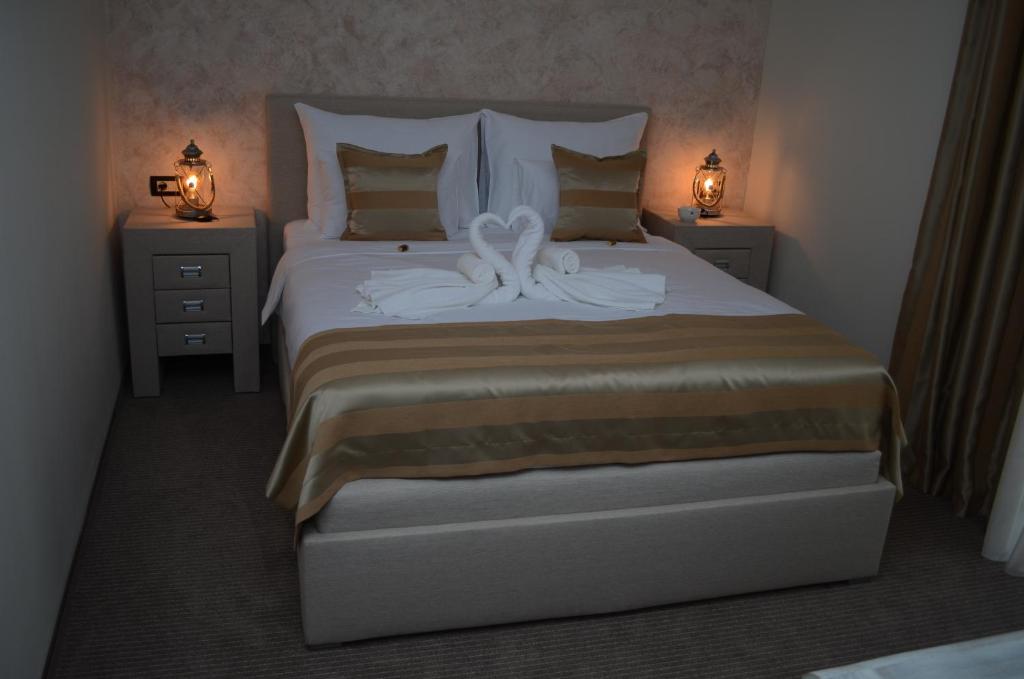 Postel nebo postele na pokoji v ubytování Hotel Helada