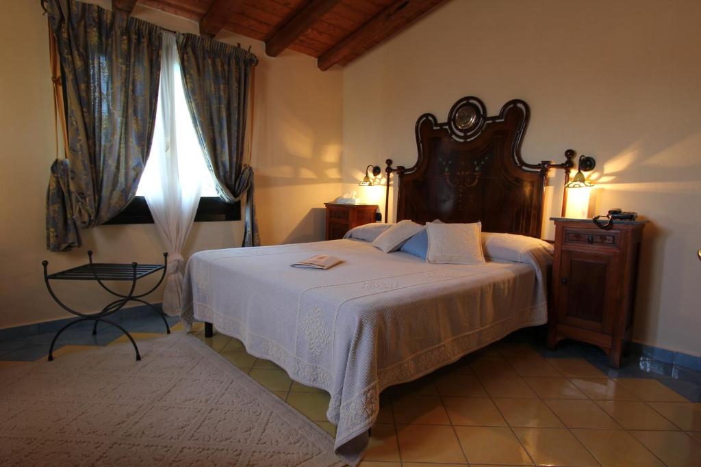Postel nebo postele na pokoji v ubytování Hotel Su Lithu
