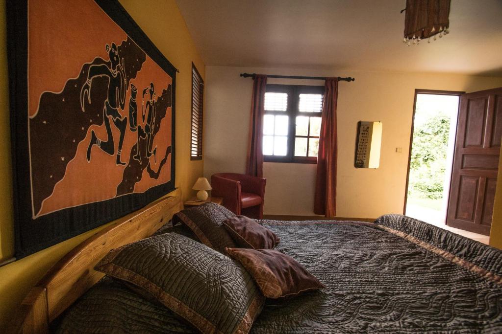 Postel nebo postele na pokoji v ubytování La muscade