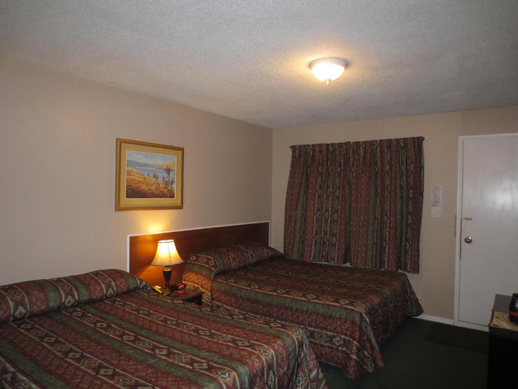 Postel nebo postele na pokoji v ubytování Overlander Motel