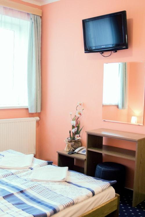 Postel nebo postele na pokoji v ubytování Rekreační komplex Losinka