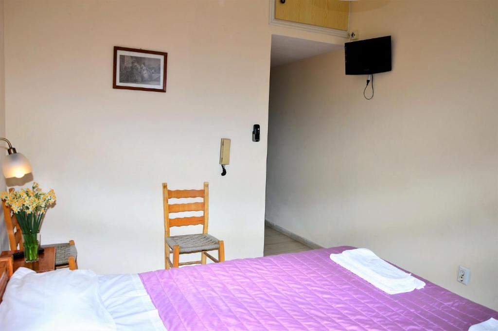 Postel nebo postele na pokoji v ubytování Pantelis