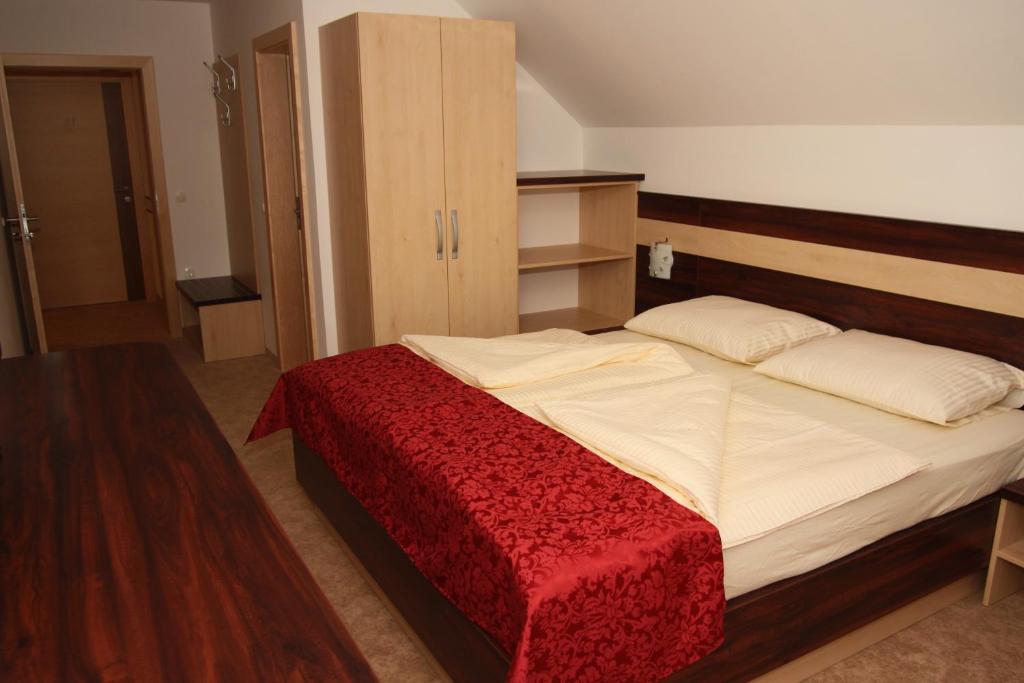 Postel nebo postele na pokoji v ubytování Guest House Hober