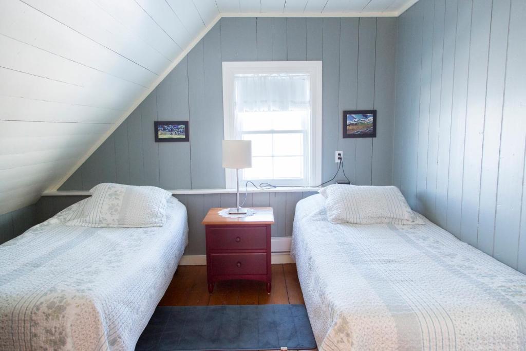 A bed or beds in a room at Gîte et Centre de Santé Au Coin De La Berge B&B and Wellness Centre