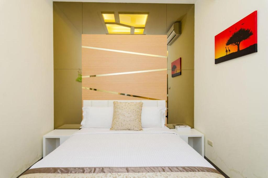 Postel nebo postele na pokoji v ubytování 海漣天海岸民宿 & 水連天海景電梯民宿 Sea Sky Coast Homestay & Shui-lian-tian Homestay