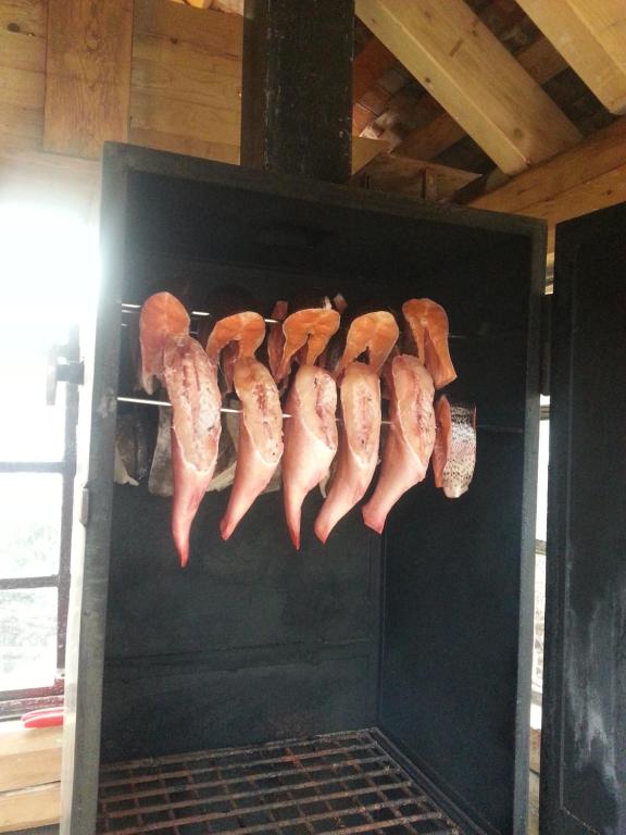 a bunch of meat on a rack in an oven at Rosenparadies in Kröpelin