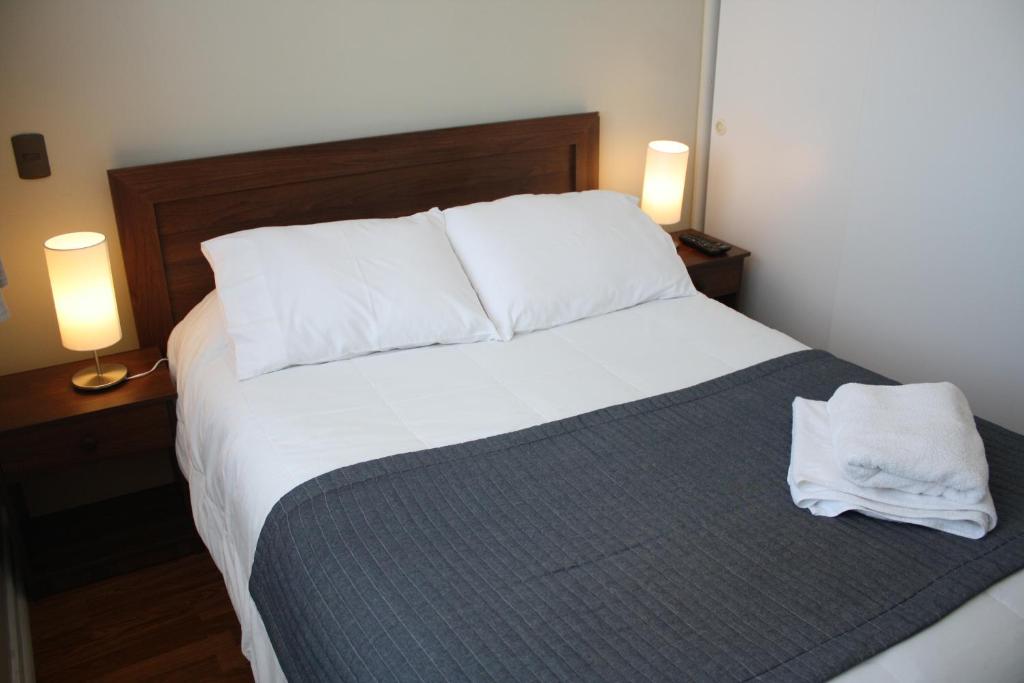 Postel nebo postele na pokoji v ubytování Hostal Buró