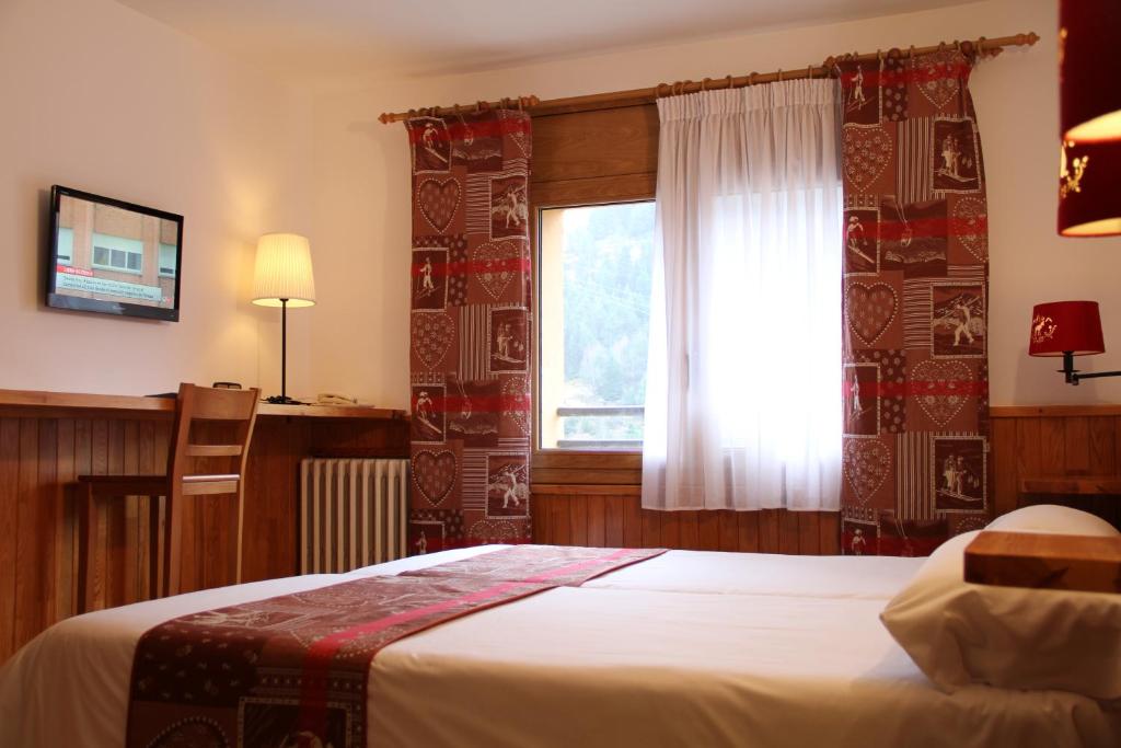 Postel nebo postele na pokoji v ubytování Hôtel Bruxelles