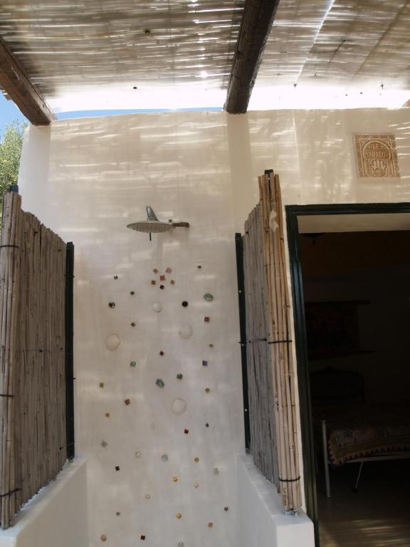 an indoor rock climbing wall with a plane on the wall at Case d'Artista in Savelletri di Fasano