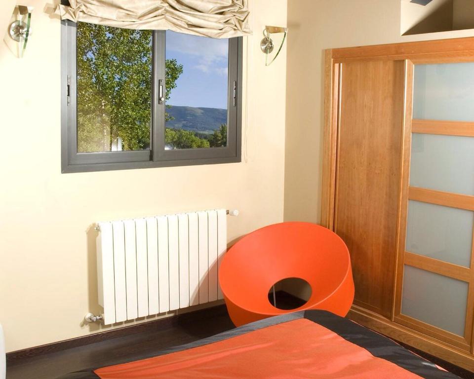 A bed or beds in a room at Alojamiento la Luz de la Sierra