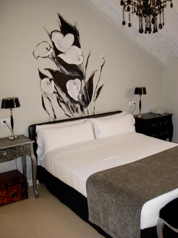 Postel nebo postele na pokoji v ubytování Hotel el Jardín de Eugenia