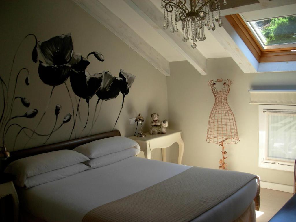 Postel nebo postele na pokoji v ubytování Hotel el Jardín de Eugenia