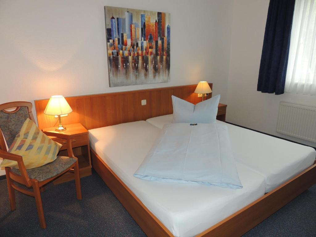 Postel nebo postele na pokoji v ubytování Hotel Stadt Munster