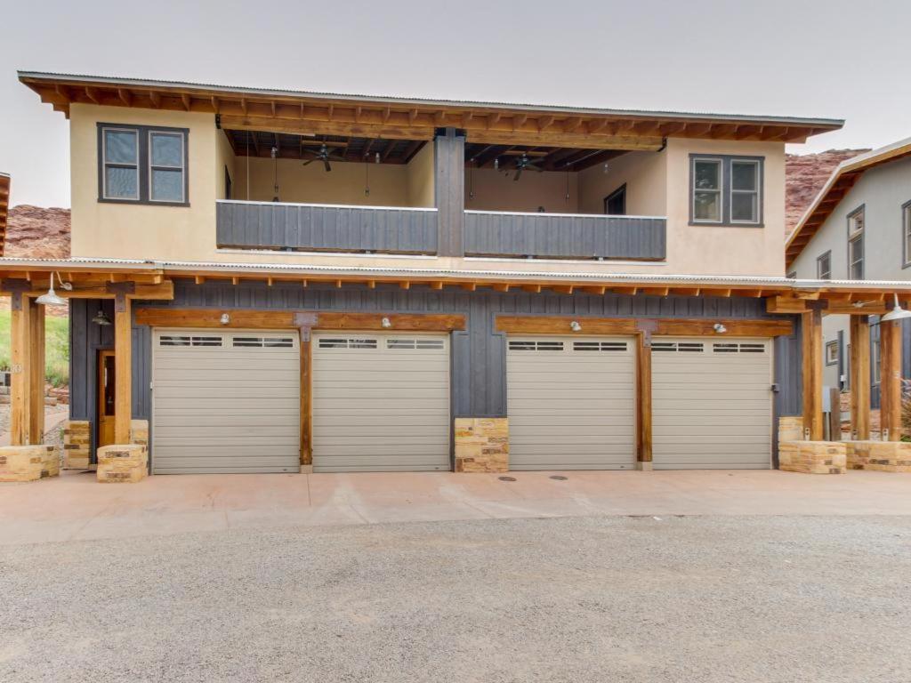 a house with four garage doors in a driveway at Moab Springs Ranch 10 in Moab