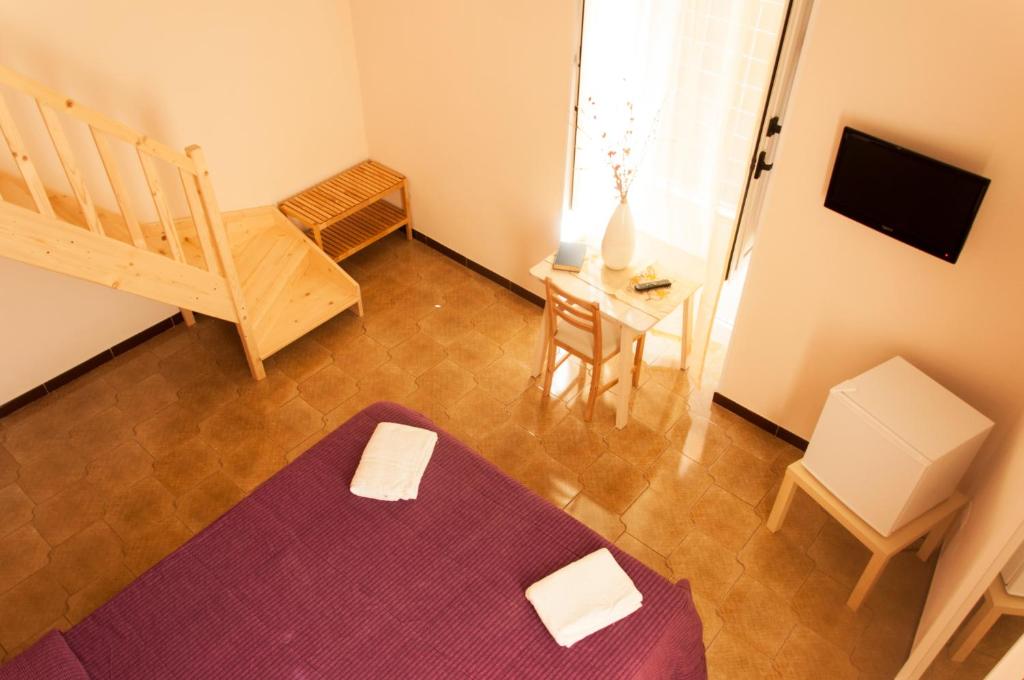 Postel nebo postele na pokoji v ubytování Rooms Palazzo Paladini
