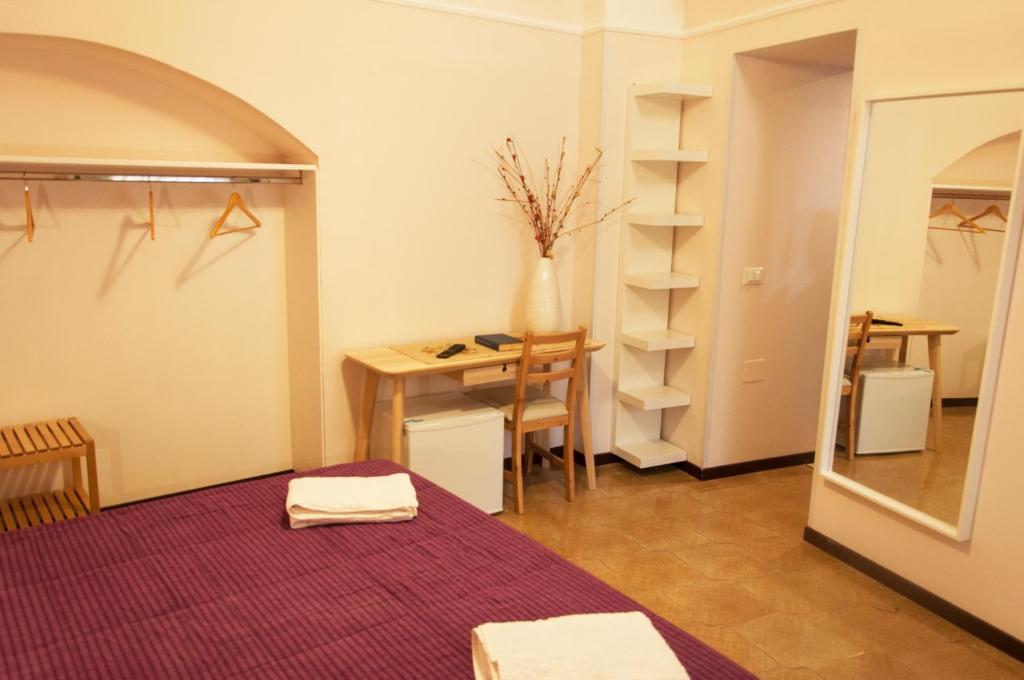 Postel nebo postele na pokoji v ubytování Rooms Palazzo Paladini