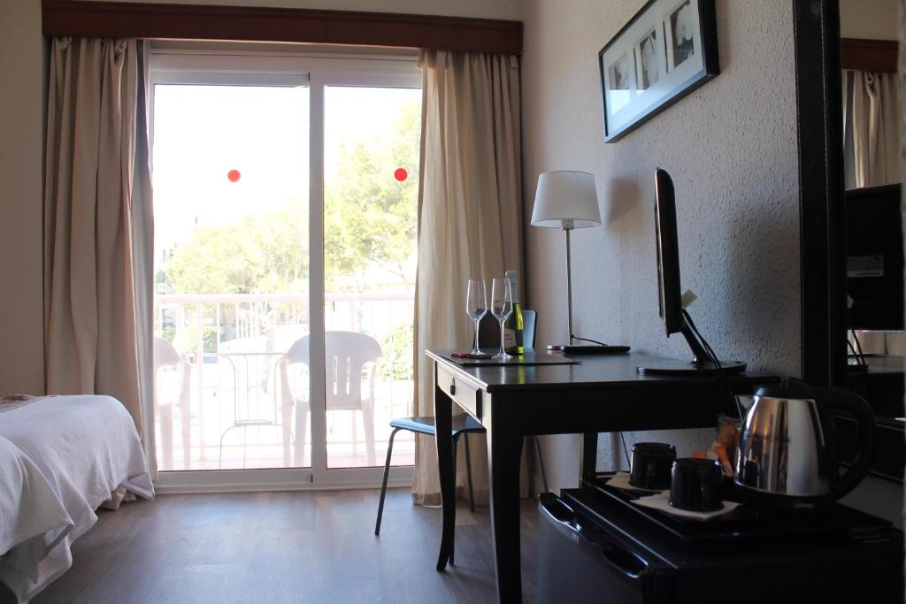 Postel nebo postele na pokoji v ubytování Hostal Jakiton