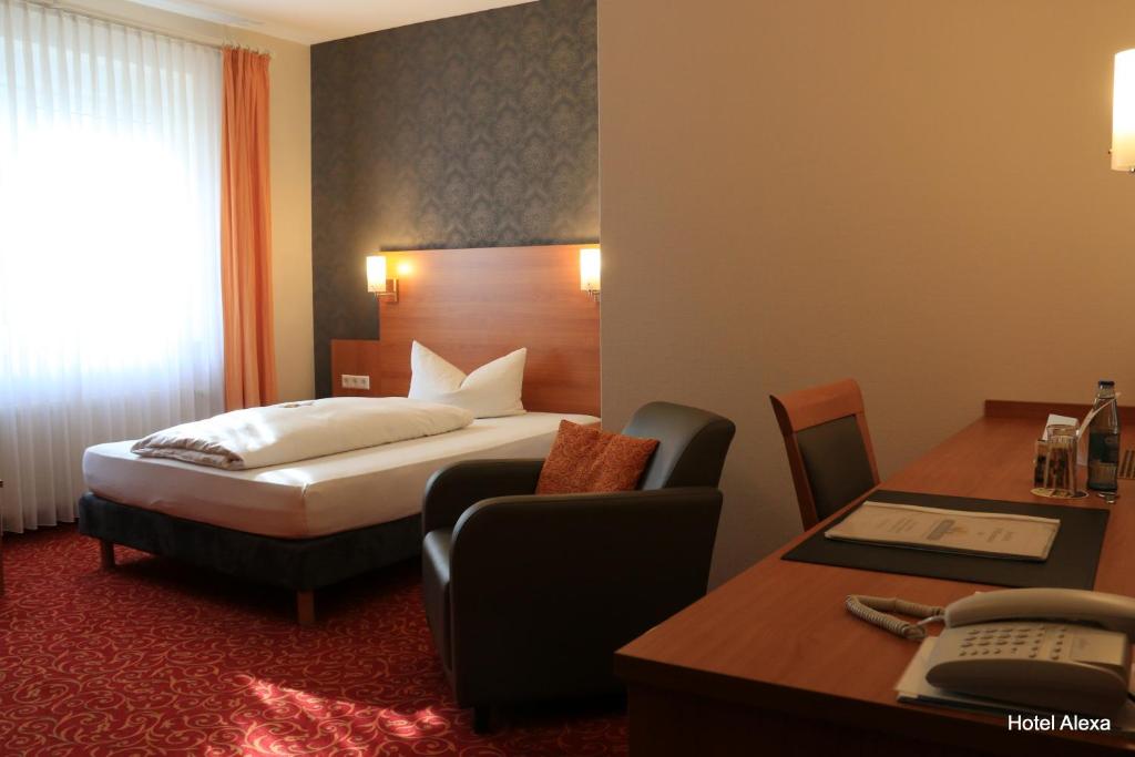 Postel nebo postele na pokoji v ubytování Hotel Alexa