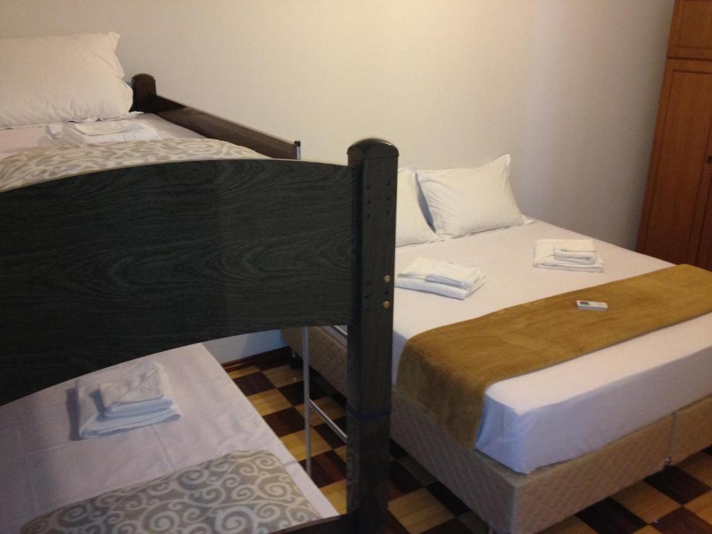Postel nebo postele na pokoji v ubytování Iguassu Central Flats