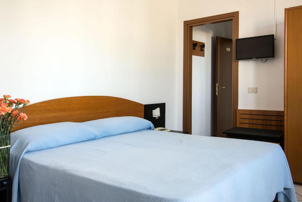 Łóżko lub łóżka w pokoju w obiekcie Hotel Internazionale