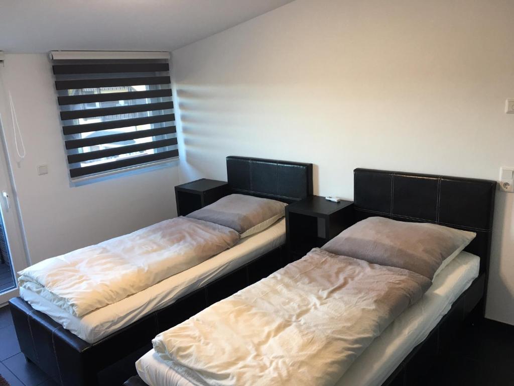 Кровать или кровати в номере Business Appartements