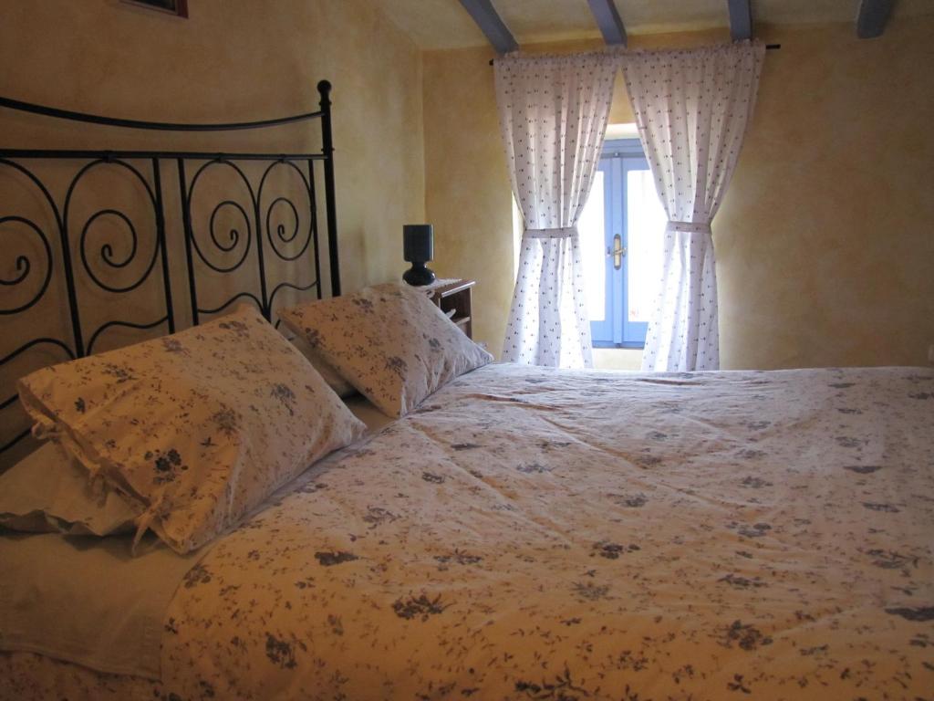 A bed or beds in a room at Maison Dina