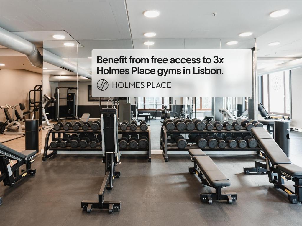 A commercial gym with free guest access is presented through its weight-training area.