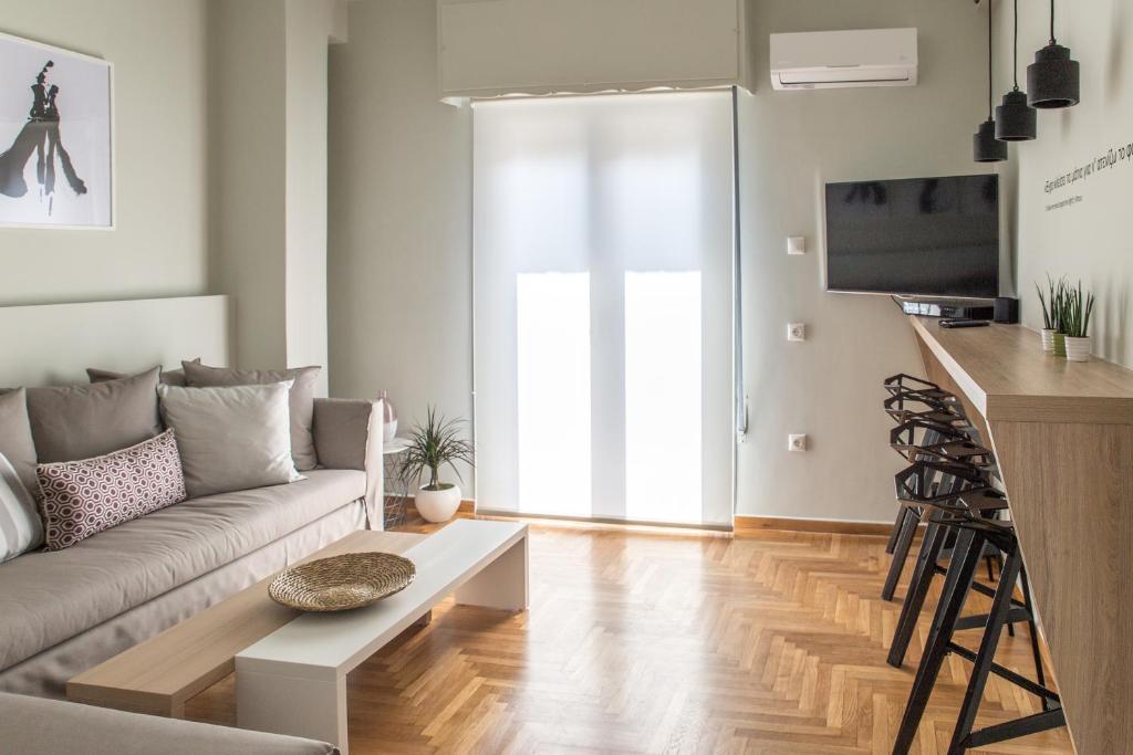 Televízia a/alebo spoločenská miestnosť v ubytovaní Muses Residence