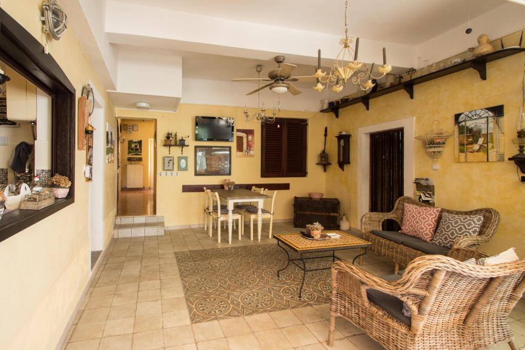 a living room with a couch and a table at Casa Segota in Veli Iž