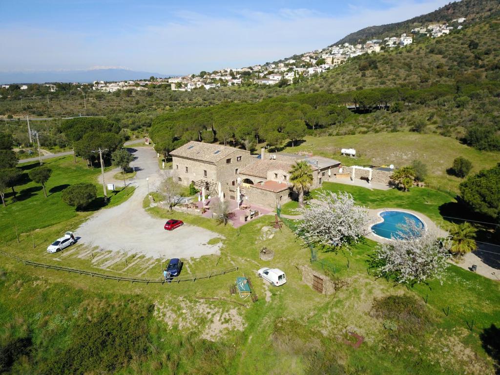 an aerial view of a house on a hill at Hotel Mas Palou in Roses