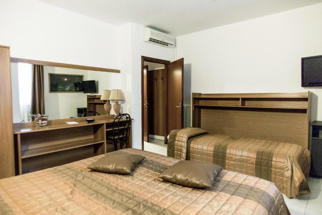 Postel nebo postele na pokoji v ubytování Hotel Europa