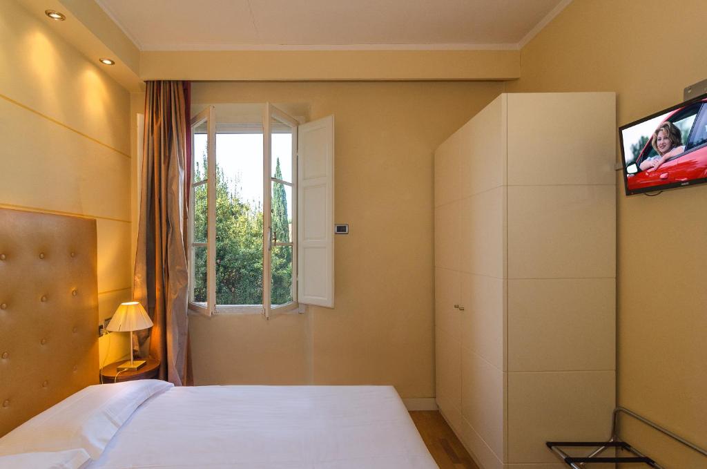 TV a/nebo společenská místnost v ubytování Hotel Novecento