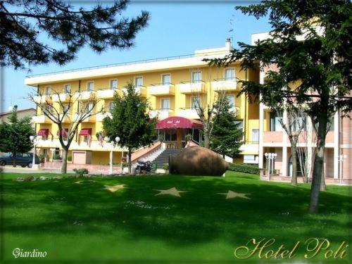 a large building with a large elephant in front of it at Hotel Poli in Castelnovo di Sotto