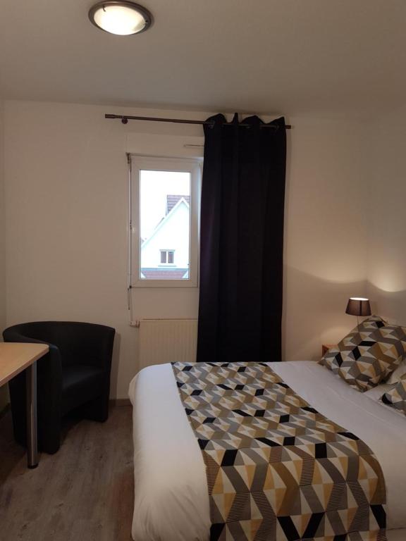 Postel nebo postele na pokoji v ubytování Hôtel Des Bois