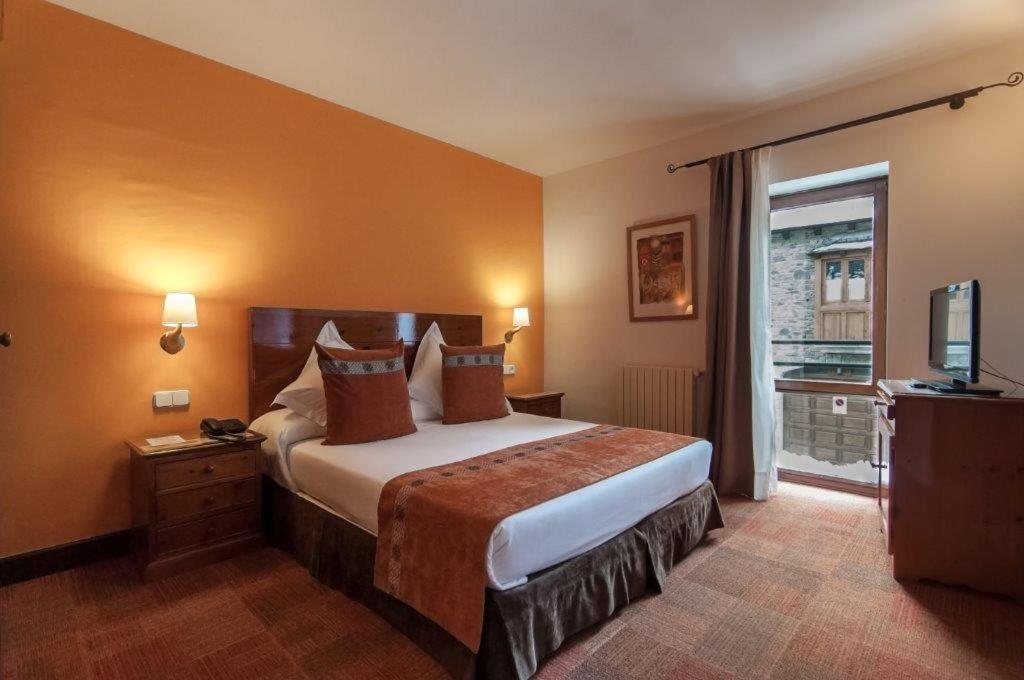 Postel nebo postele na pokoji v ubytování Hotel Vilagaros