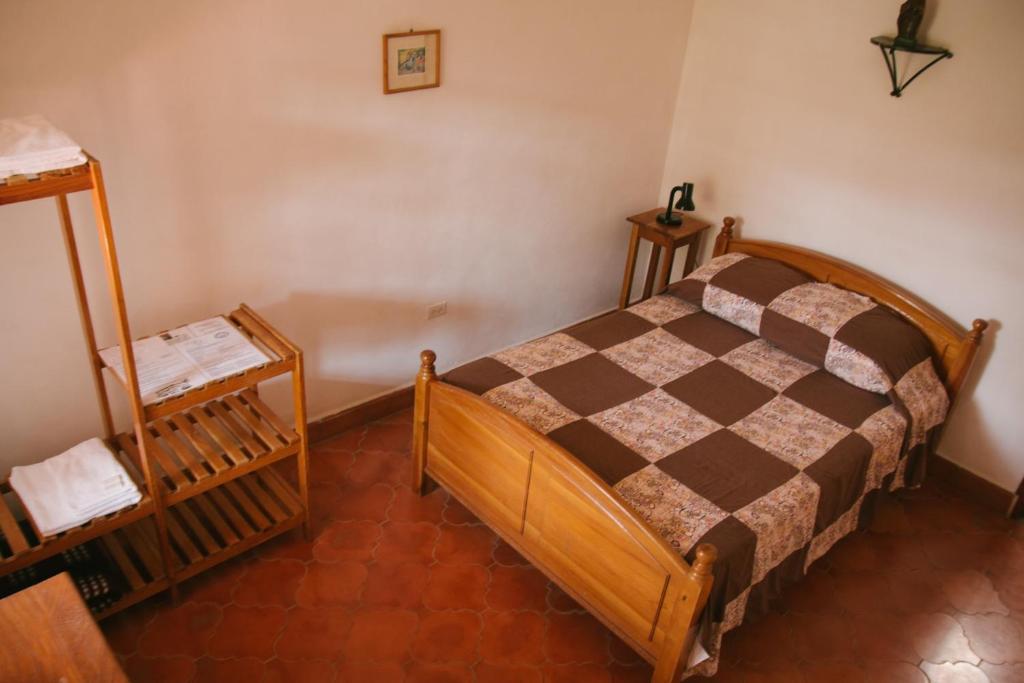 Postel nebo postele na pokoji v ubytování La Casa de Cafe Bed and Breakfast