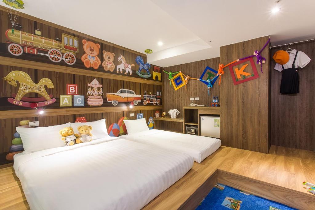 Postel nebo postele na pokoji v ubytování RF Hotel - Sanchong