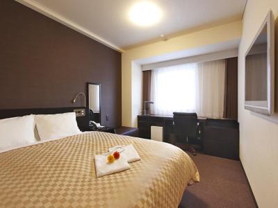 Postel nebo postele na pokoji v ubytování Hotel nanvan浜名湖