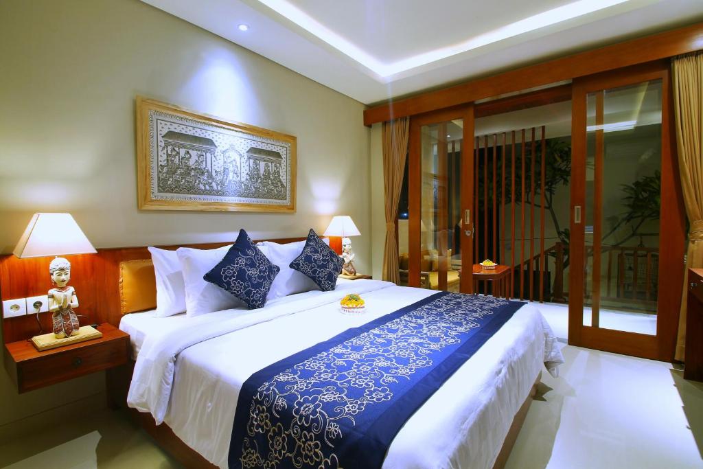 Postel nebo postele na pokoji v ubytování Narada House Ubud