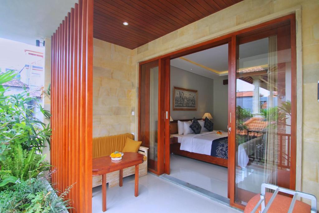 Postel nebo postele na pokoji v ubytování Narada House Ubud