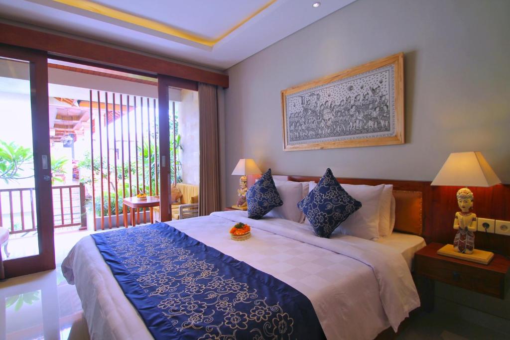 Postel nebo postele na pokoji v ubytování Narada House Ubud