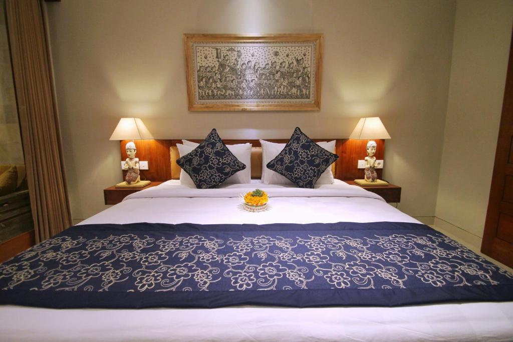 Postel nebo postele na pokoji v ubytování Narada House Ubud