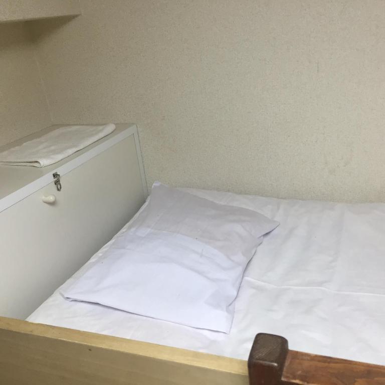Postel nebo postele na pokoji v ubytování Yamate Rest House (Male Only)