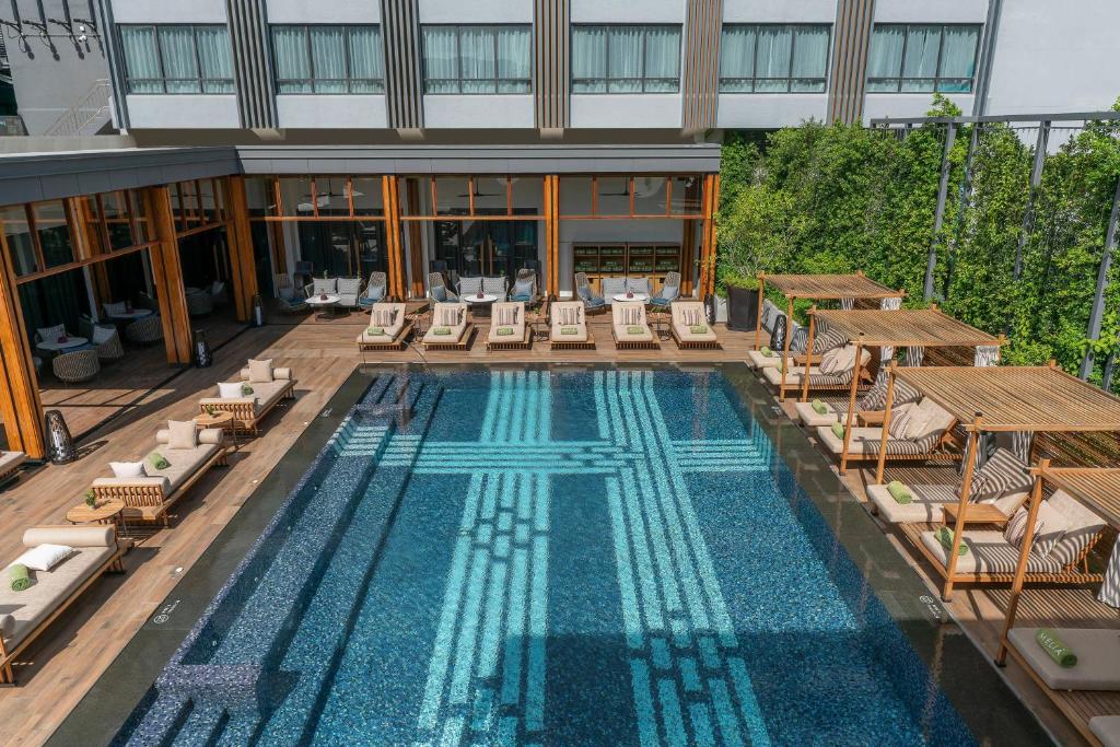 An elevated view of the hotel pool courtyard beside the main building.
