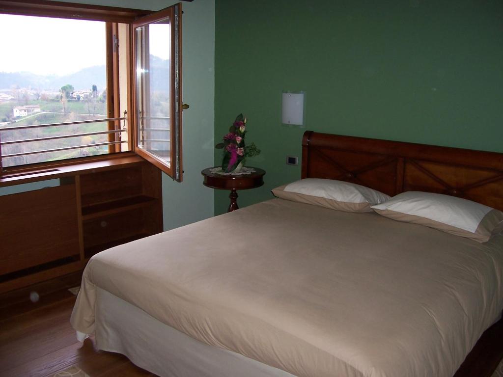 Postel nebo postele na pokoji v ubytování Locanda da Gerry