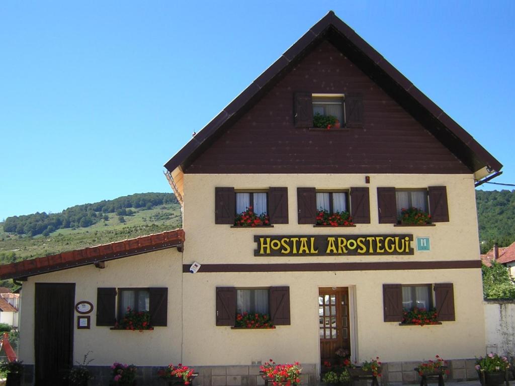 a building with a sign that reads hospital applegate at Hostal Arostegui in Garayoa