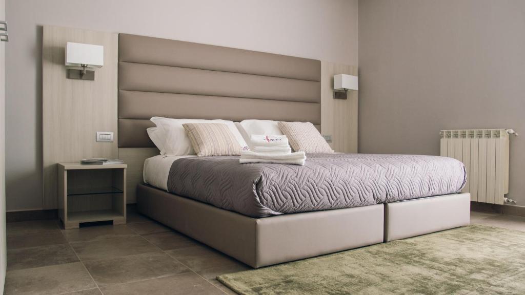 Postel nebo postele na pokoji v ubytování Alludo Aparthotel b&b